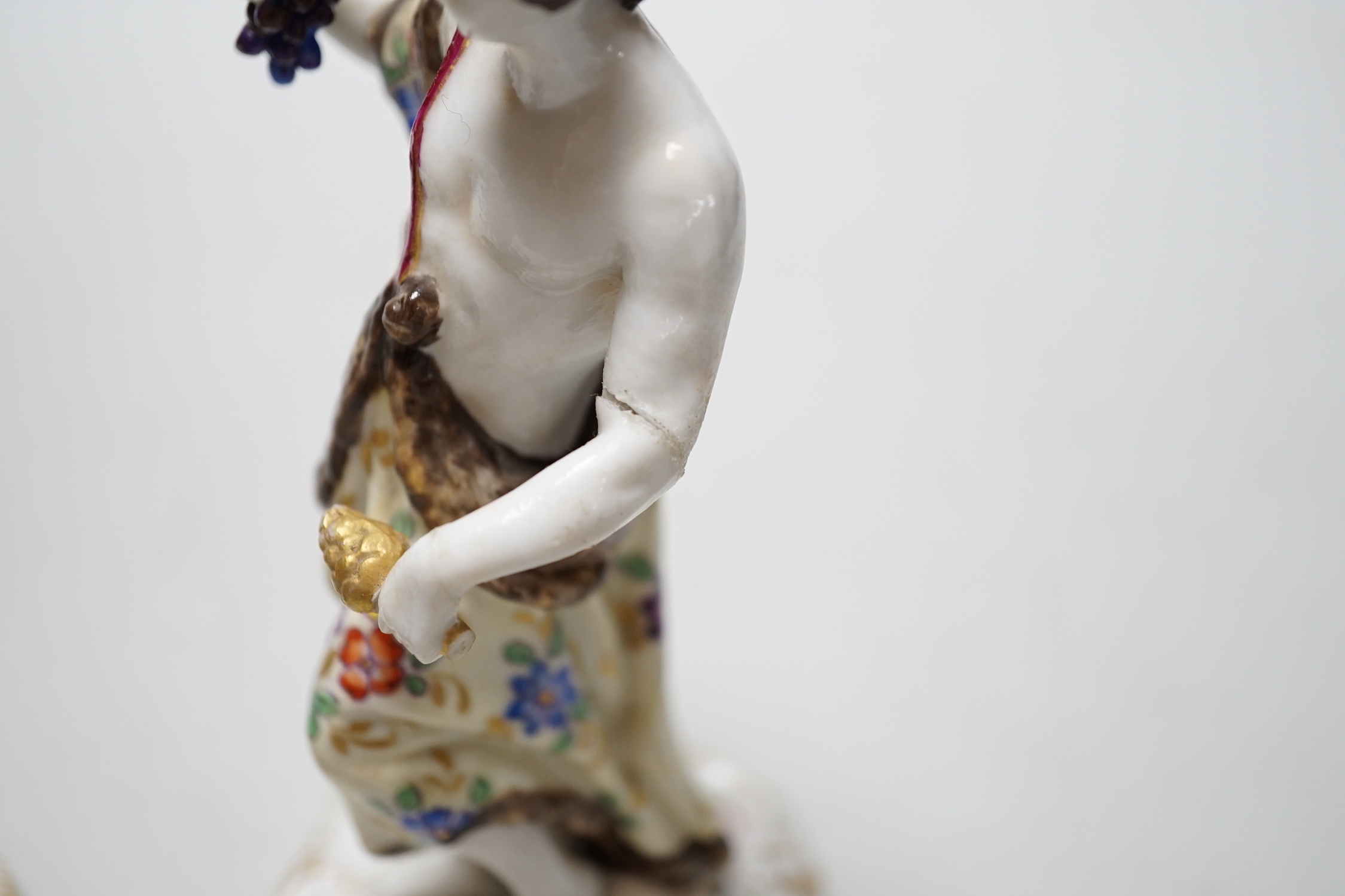 A pair of German Volkstedt porcelain figures including female with dragon, 15cm high
